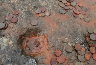 Coins on Stone at St Columba's Birthplace